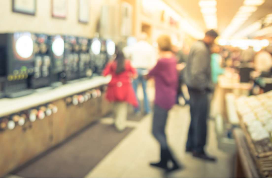 blurred photo of people shopping at convenience store