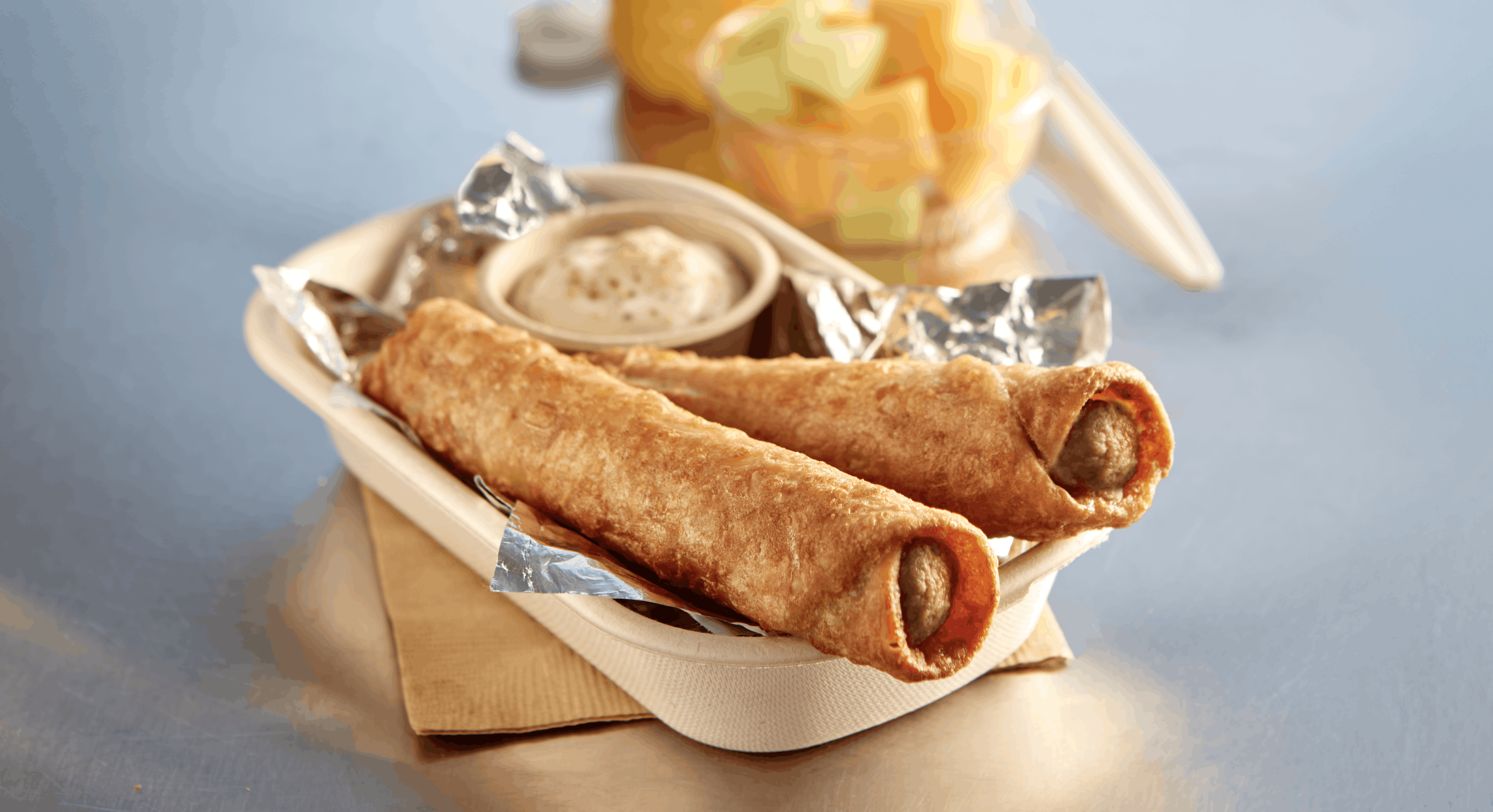 Two French Toast & Sausage Tornados in a food boat