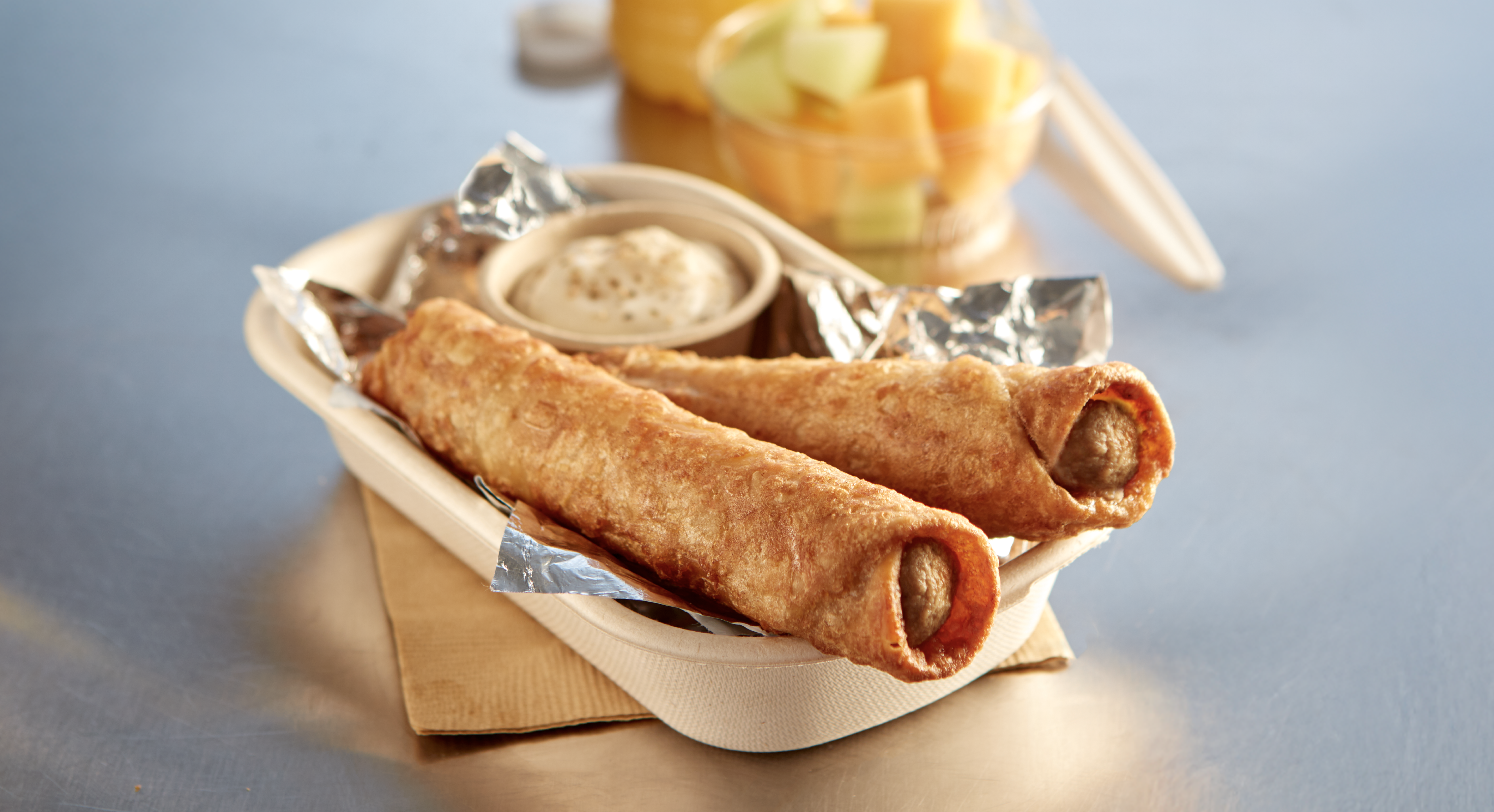 Two French Toast & Sausage Tornados in a food boat