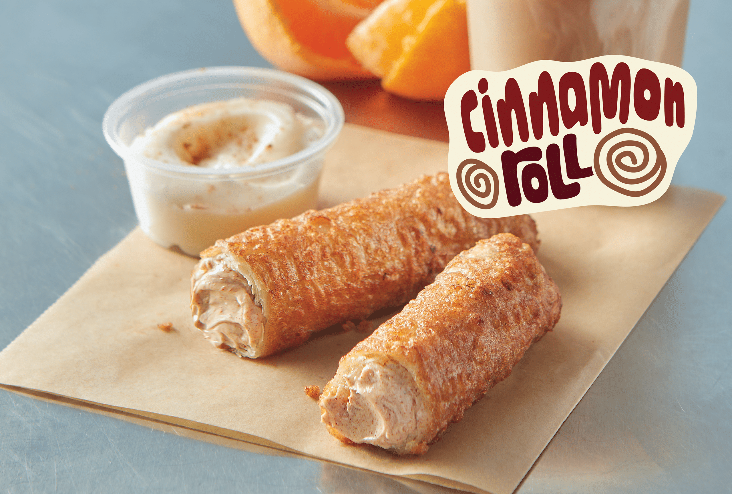 One Cinnamon Roll Tornados broken open to show the filling
