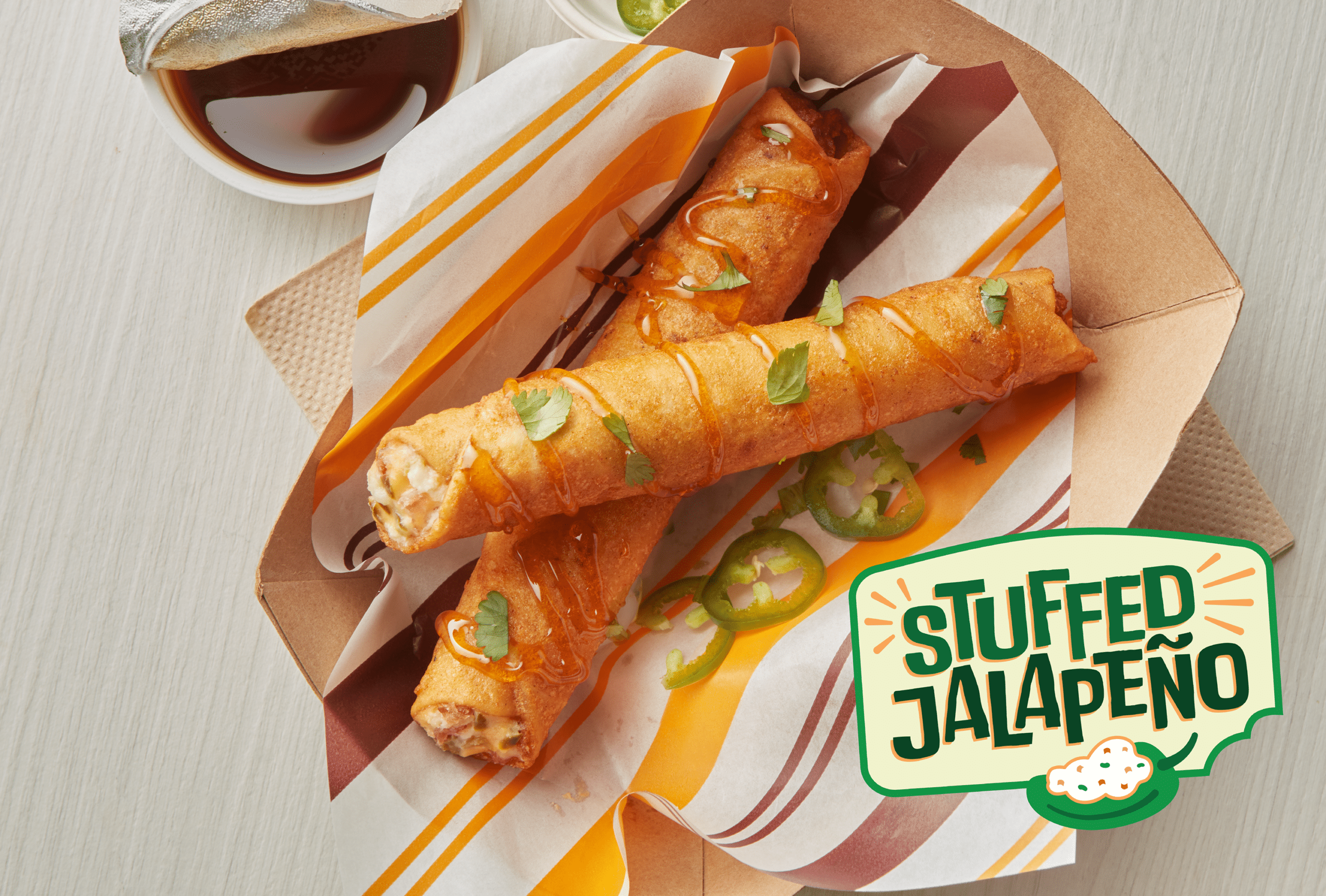 Two Stuffed Jalapeno Tornados in a food boat